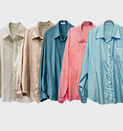 Collection of button-up shirts in various colors, embellished with natural gemstones, showcasing style and elegance.